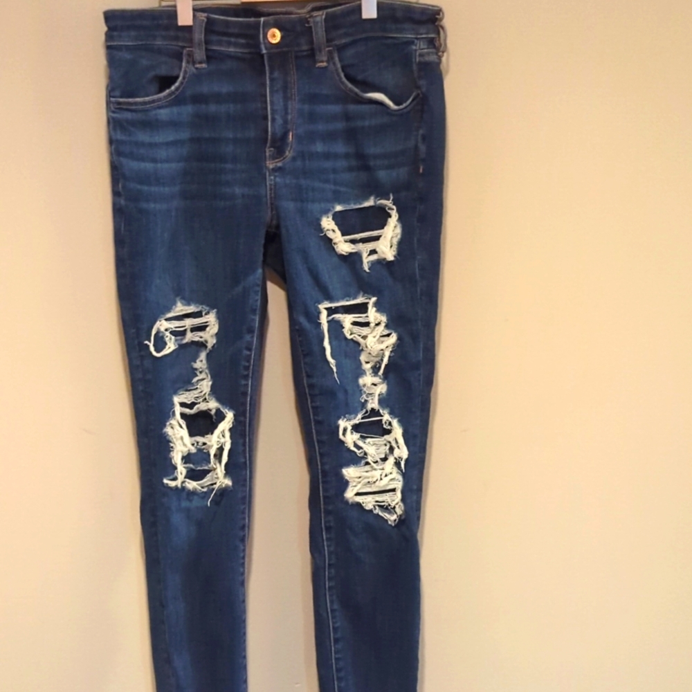 Lightly worn high waisted Size 10 AE stretch jeggings with distressed detail.
